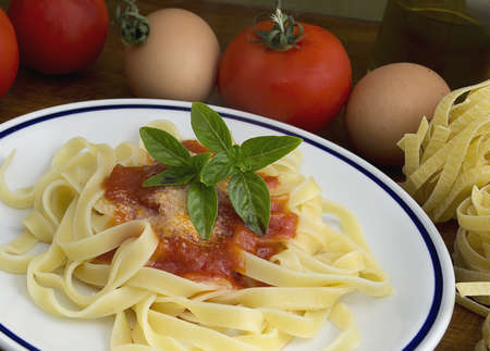 tagliatelle and basil with ingredients all aroundの写真素材