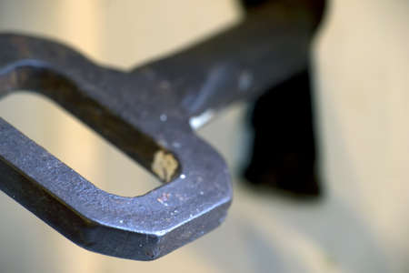 macro view of a metal key in the holeの写真素材