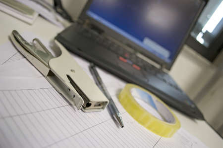 office tools, laptop and paperの写真素材