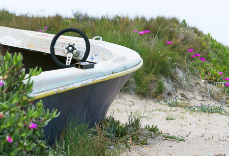 old boat on  a dune near the seaの写真素材