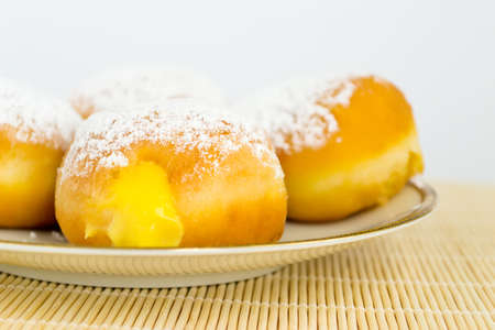 cluster of donuts on a white plateの写真素材