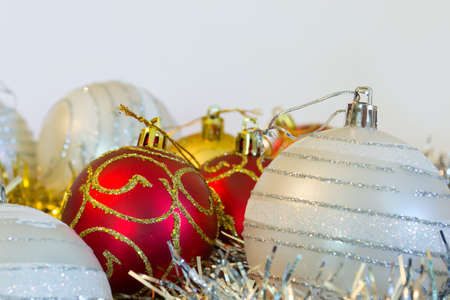 closeup of a Christmas ball in silver color with other decorationsの写真素材