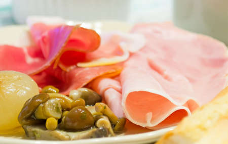 onion, mushroom and ham in a ceramic plateの写真素材