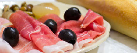 appetizer with raw ham, olives and more..の写真素材