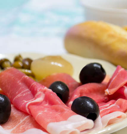 appetizer with raw ham, olives and more..の写真素材