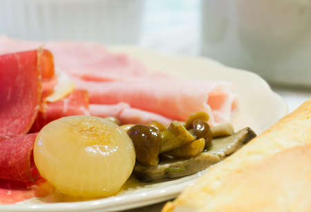 onion, mushroom and ham in a ceramic plateの写真素材