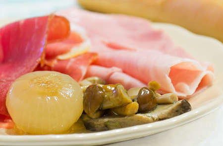 onion, mushroom and ham in a ceramic plateの写真素材