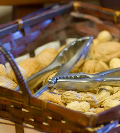 peanuts and walnut in a wooden basketの写真素材