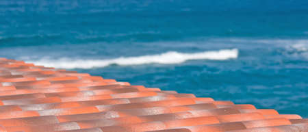 detail of roof tiles by the seaの写真素材