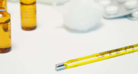 thermometer, phials and pillsの写真素材