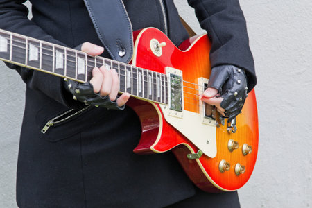 girl playing guitar solo