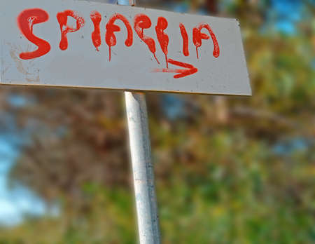 signal with "Spiaggia" written on itの写真素材