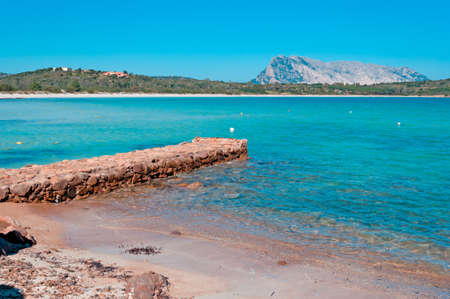 pier made of stones in brandinchi coveの写真素材