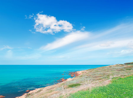 detail of Sardinian coastline on a cloudy dayの写真素材