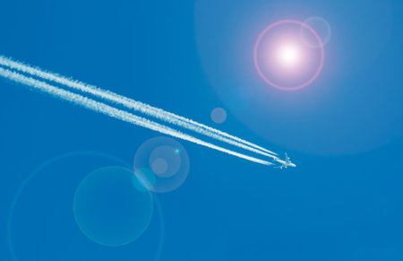 contrails under a bright sun