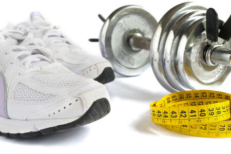 running shoes, tape and metal dumbbell on white backgroundの写真素材