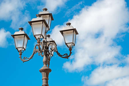 street lamp under a blue cloudy skyの写真素材
