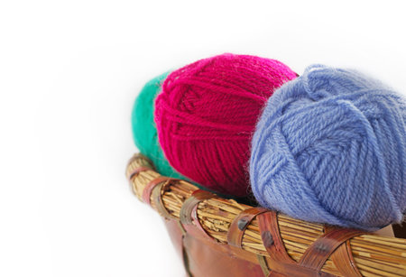 balls of wool in a wicker basket