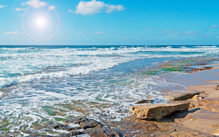 sun and blue water in Castelsardoの写真素材