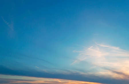 blue and orange sky at sunsetの写真素材