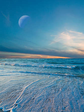 Sardinia foreshore at dusk under the moonの写真素材