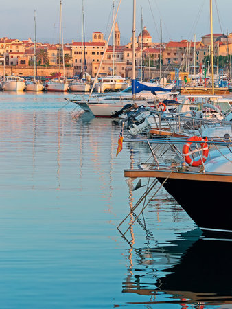 boats in Alghero harbor at duskの写真素材