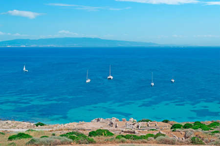 boats in Tharros coastline, Sardiniaの写真素材