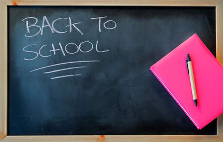 "back to school" writing with pink notebookの写真素材