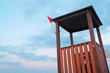 lifeguard tower under a cloudy skyの写真素材