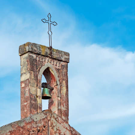 close up of a church bell on a cloudy dayの写真素材