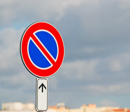 road sign on a cloudy dayの写真素材