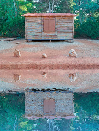 wooden cabin by the waterの写真素材
