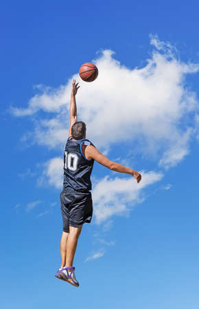 basketball player shooting in the skyの写真素材