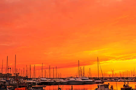 orange sky over Alghero harborの写真素材