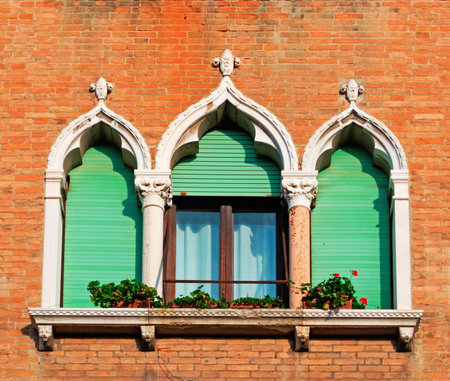 antique windows in a brick wallの写真素材
