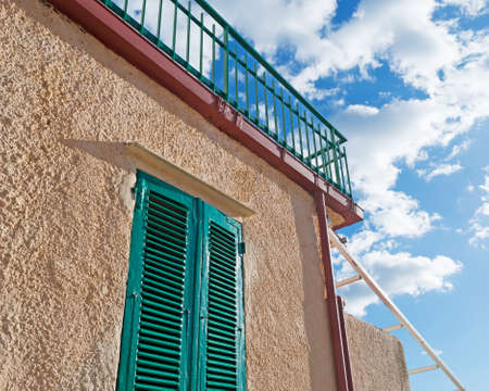 rustic window on a cloudy dayの写真素材