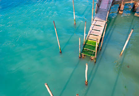 wooden pier in Grand Canal seen from aboveの写真素材