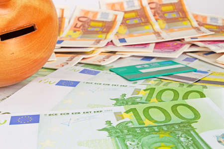 money box, cash and credit cardsの写真素材