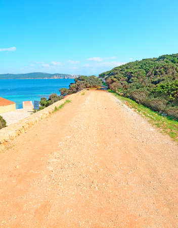 dirt road by Cala Dragunara beach, Sardiniaの写真素材
