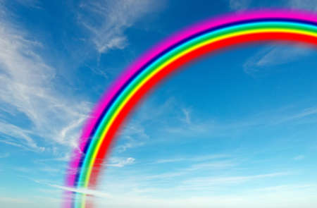 blue sky with white clouds and colorful rainbowの写真素材