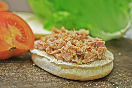 close up of a sandwich with tuna, tomatoes and lettuceの写真素材