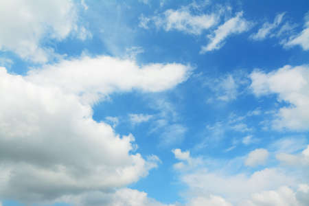 blue sky with white, soft cloudsの写真素材