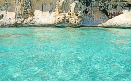 turquoise water and rocks in Orosei Gulf coastline, Sardiniaの写真素材