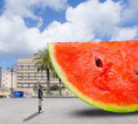 huge watermelon in a urban squareの写真素材
