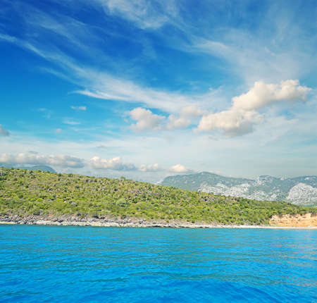 Cala Gonone shoreline on a cloudy dayの写真素材