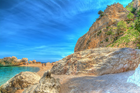 Cala Mariolu shore on a clear day. hdr tone mapping.の写真素材