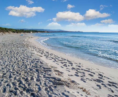 white clouds over Maria Pia beach, sardiniaの写真素材