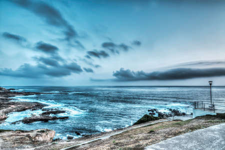 grey sky over Alghero coastlineの写真素材