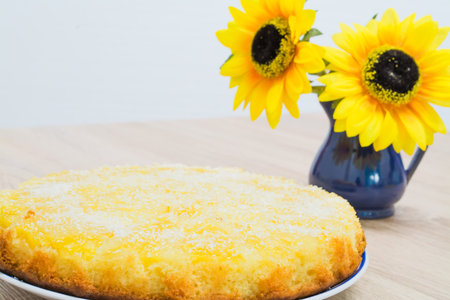 ananas and coconut cake on a wooden table