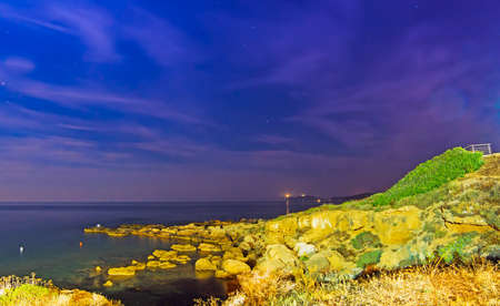 Alghero rocky shoreline by nightの写真素材